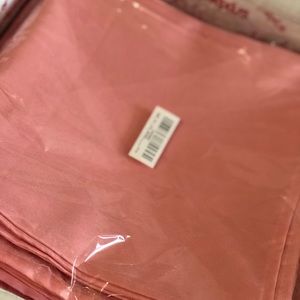 100 polyester blush/coral napkins